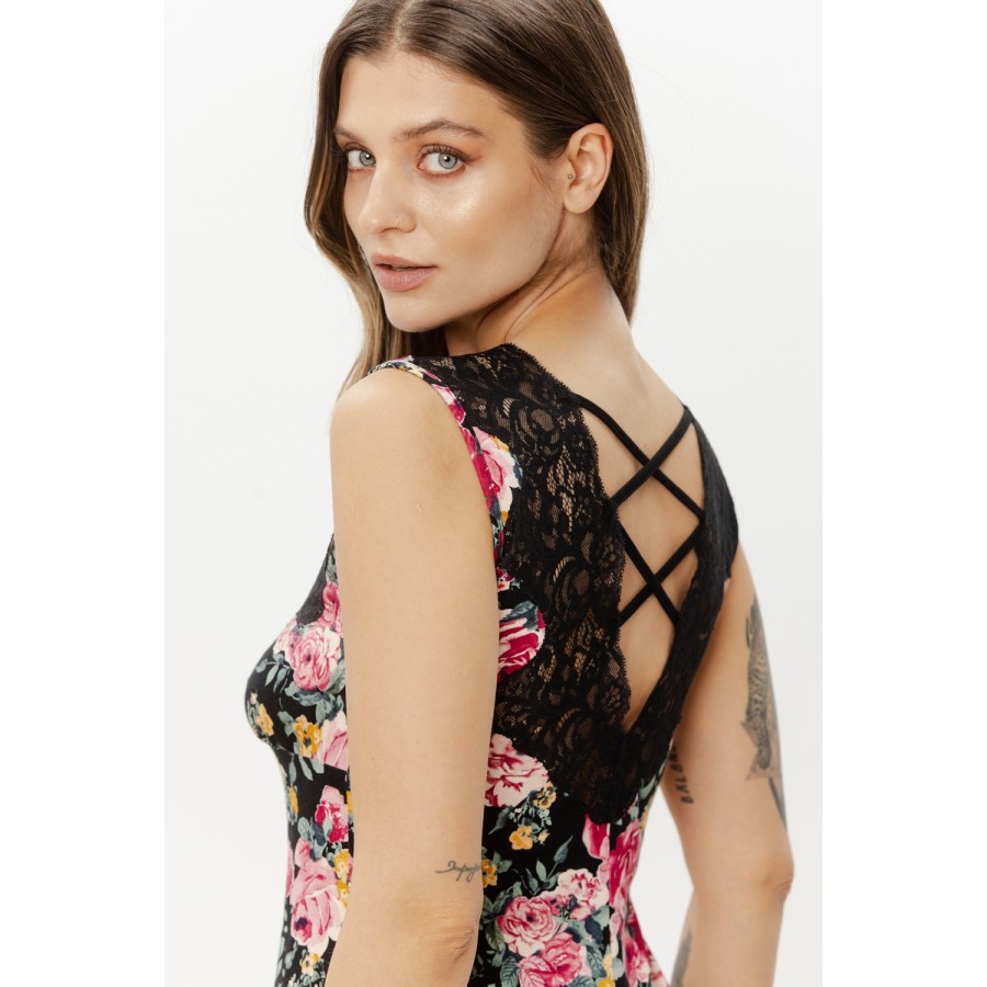 Close-up black lace bust detail on flowered viscose nightie