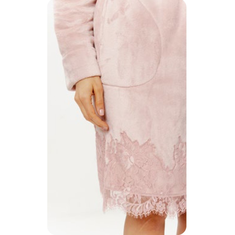 Pink bathrobe draped over shoulder showcasing shawl collar and sleeve