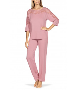 Two-piece pyjamas comprising a top with lace-trimmed boat neck and long trousers. Coemi-lingerie