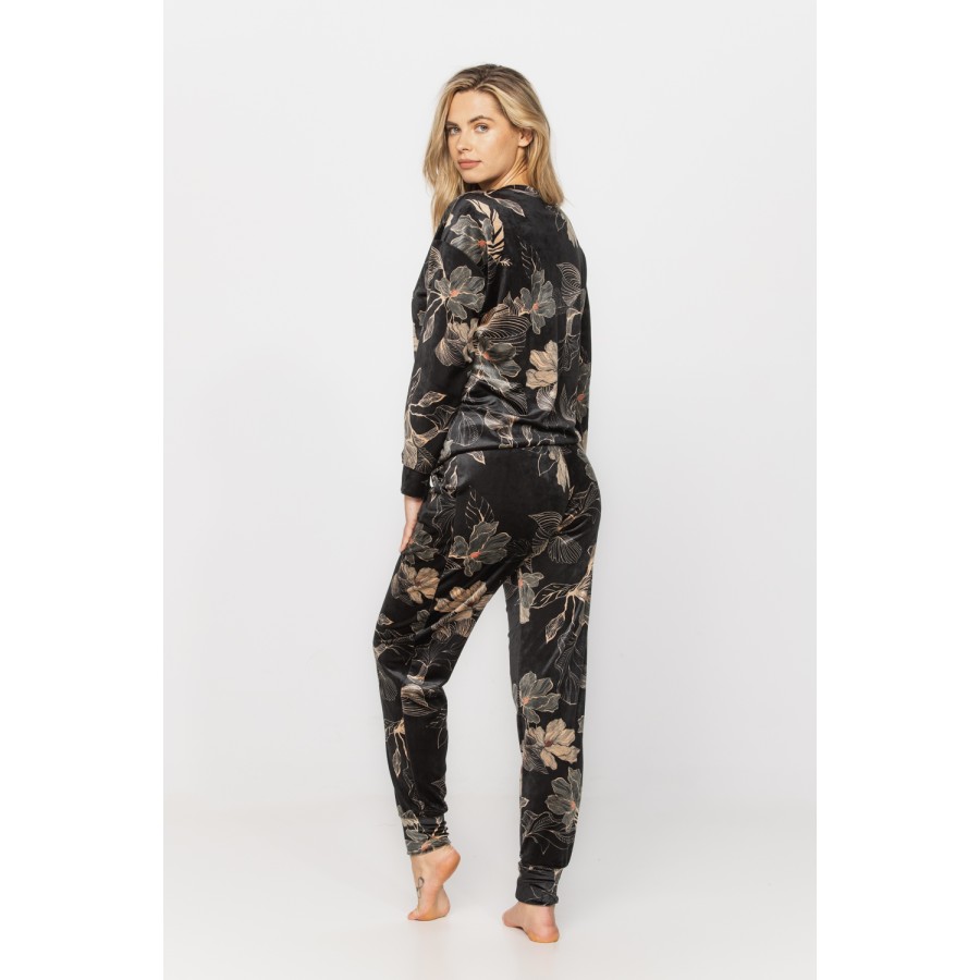 Velvet loungewear outfit printed with sketches of golden flowers on a black background