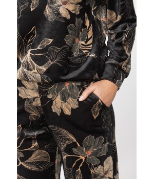 Velvet loungewear outfit printed with sketches of golden flowers on a black background