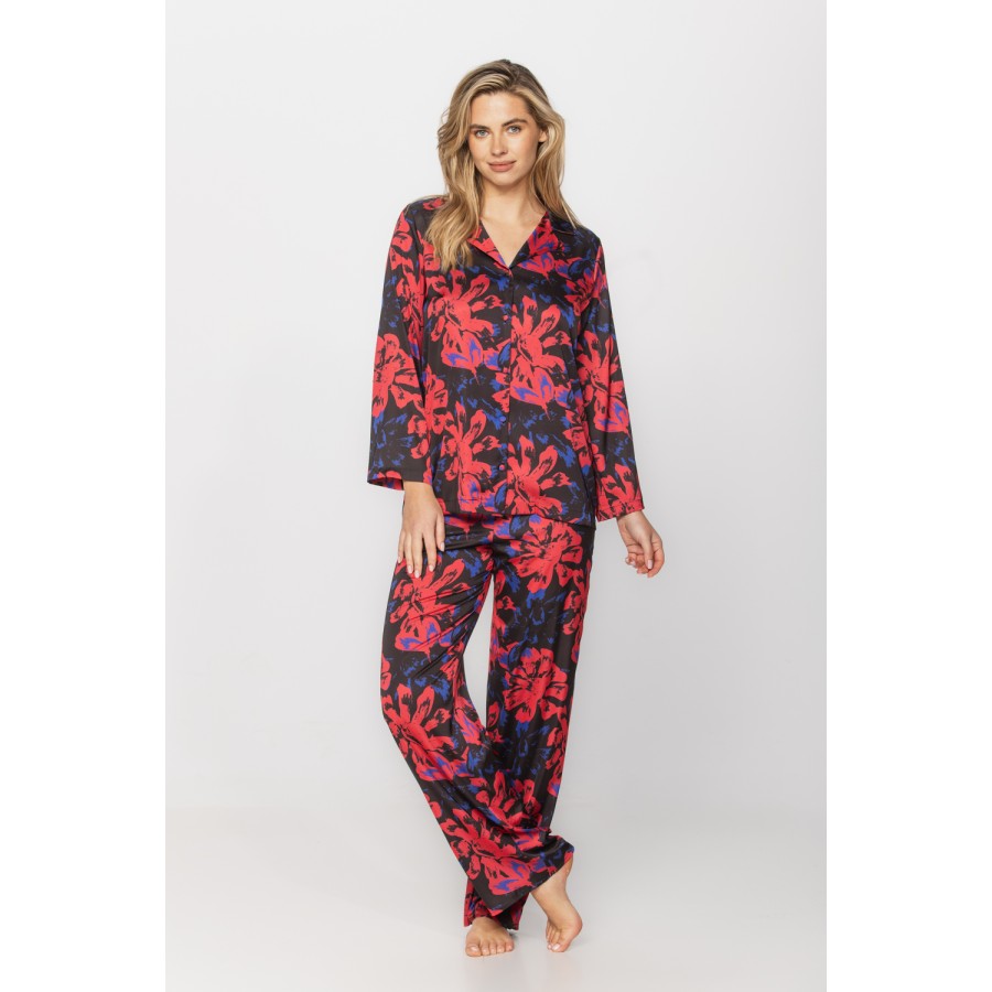 Satin pyjamas in a blue and red print on a black background, nightshirt-style top and bottoms