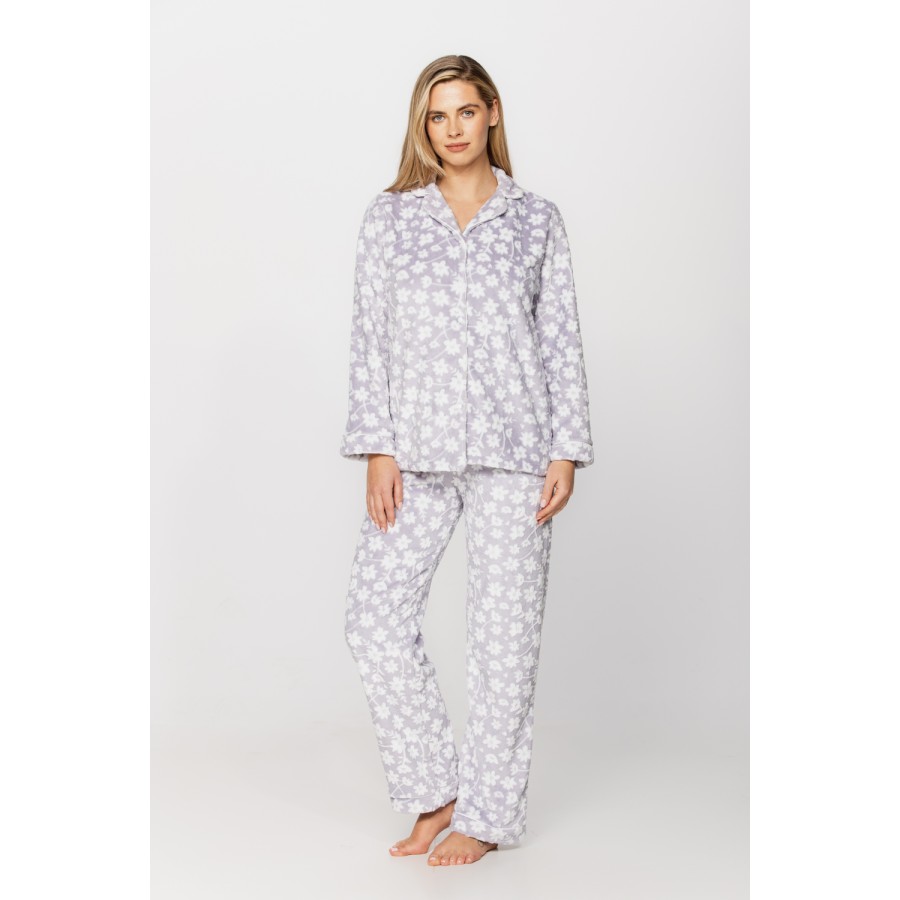 Warm velvet loungewear outfit, button-up top and straight-cut bottoms with floral print on a grey background