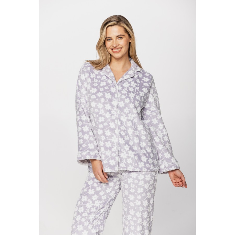 Warm velvet loungewear outfit, button-up top and straight-cut bottoms with floral print on a grey background