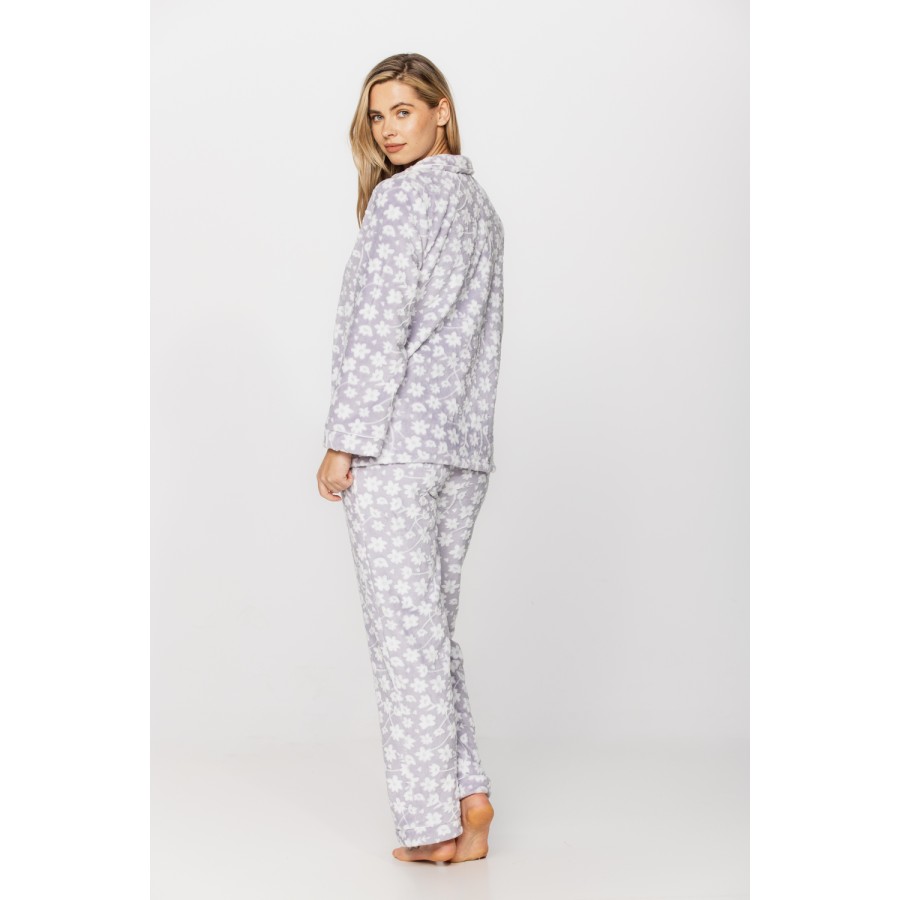 Warm velvet loungewear outfit, button-up top and straight-cut bottoms with floral print on a grey background