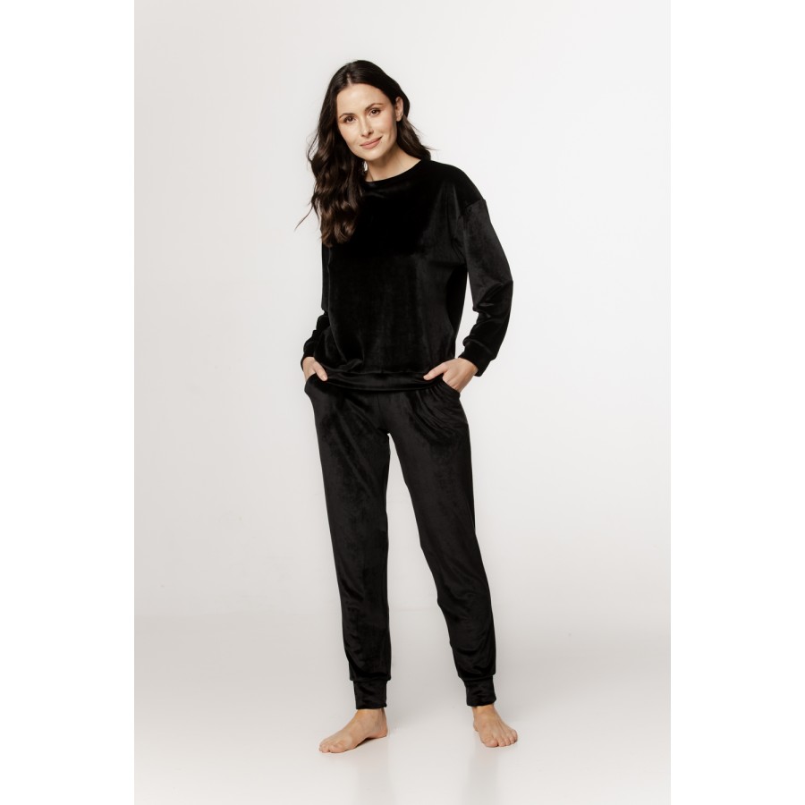Velvet loungewear set with a round neck top, long sleeves, straight pants, and side pockets
