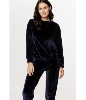 Velvet loungewear set with a round neck top, long sleeves, straight pants, and side pockets