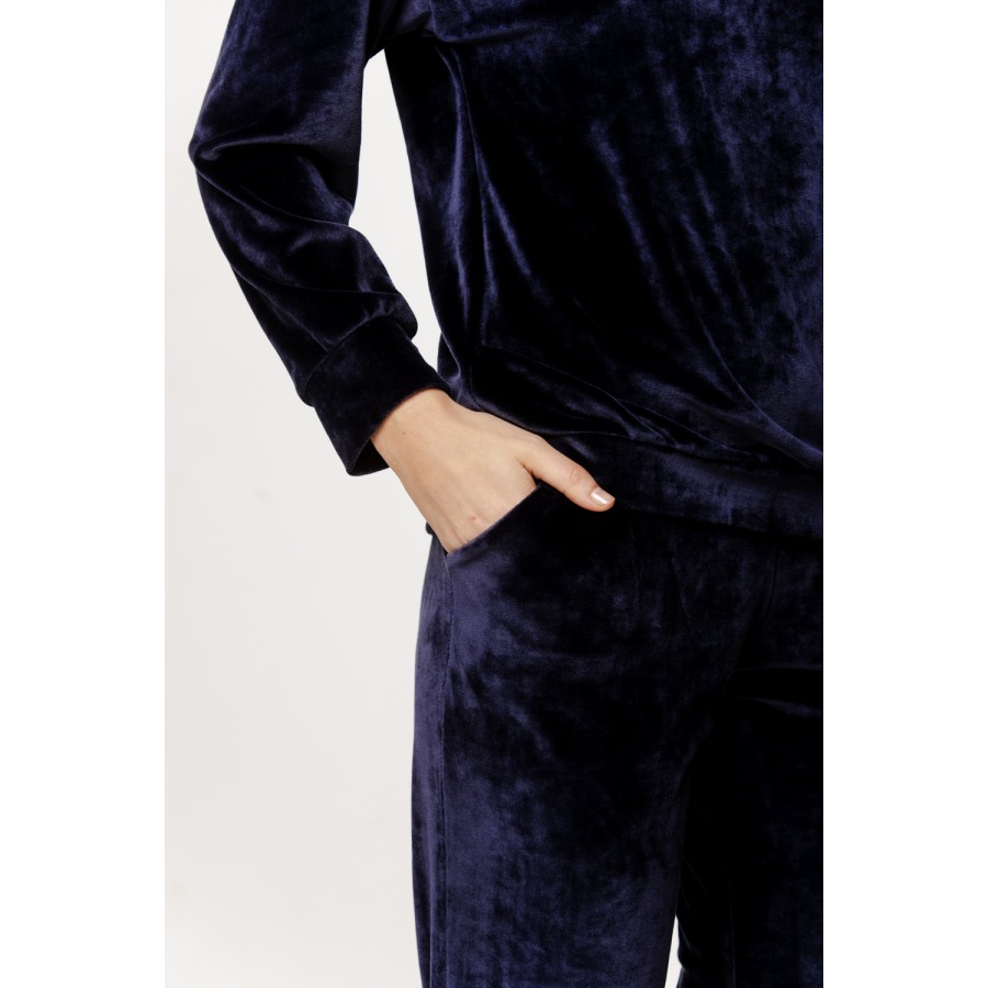 Velvet loungewear set with a round neck top, long sleeves, straight pants, and side pockets