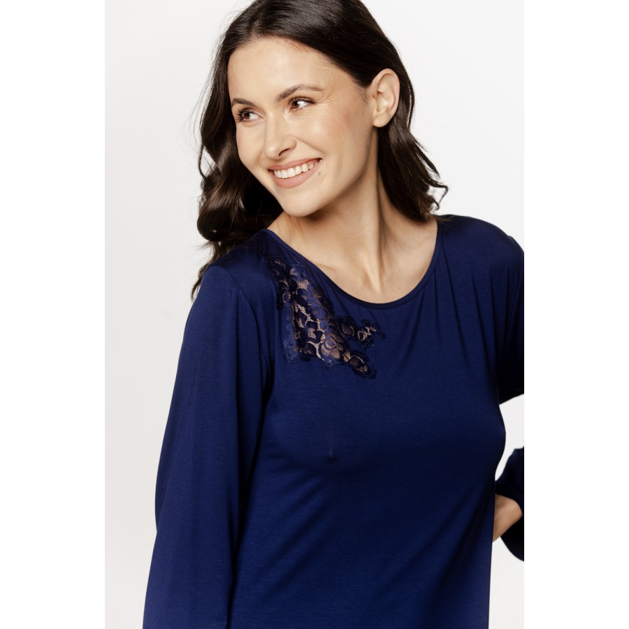 Long, loose-fitting nightgown with long sleeves and embroidery on the upper bust.