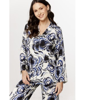 Loose-fitting viscose satin pajama set with a blue and black pattern. Shirt top and loose-fitting pants.
