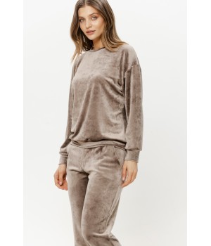 Close-up of soft velour fabric texture on loungewear set sleeve