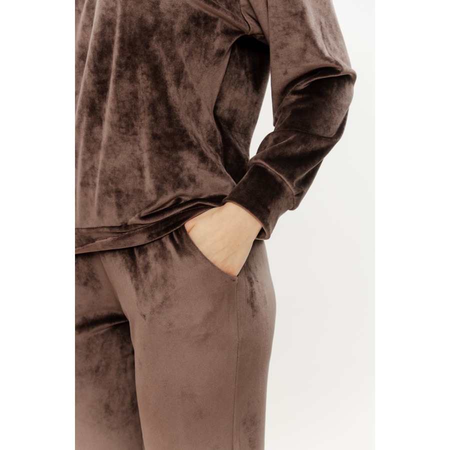 Lifestyle shot of soft velour loungewear set in home setting