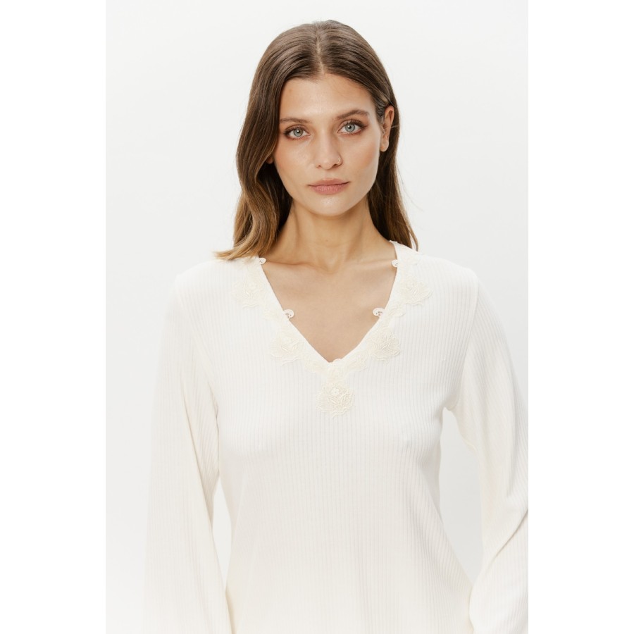 Lace trim detail on three-quarter sleeve of white pajama tee