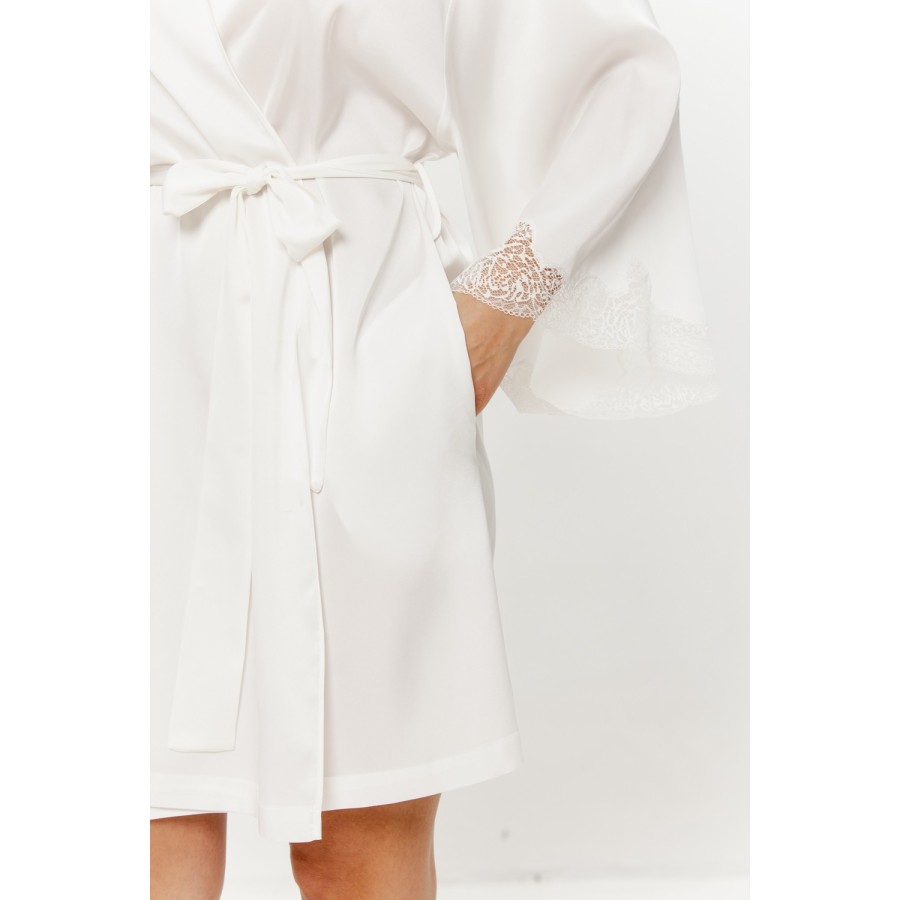 White satin robe draped over the shoulder, showing 3/4 sleeve length and lace trim
