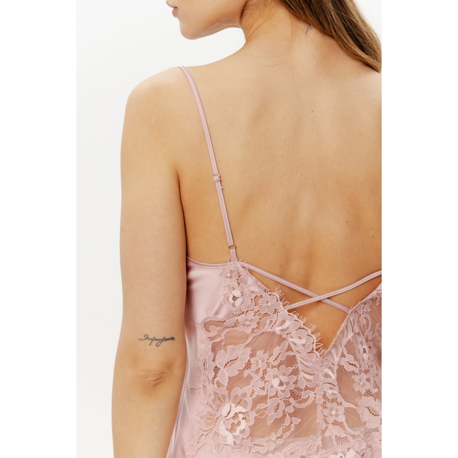 Side angle of beige satin nightie with spaghetti straps, lace hem and back detailing