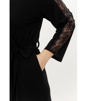Rear view of a knee-length black robe featuring lace-adorned sleeves and belt