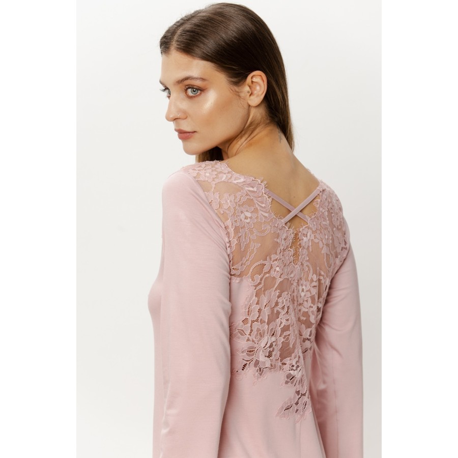 Close-up of delicate lace and ribbon lacing on nightgown back